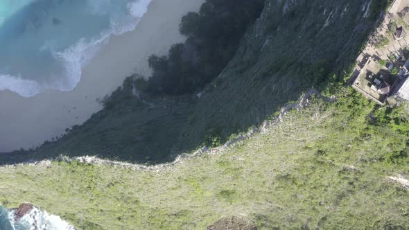 Nusa Penida island Kelingking Beach in Indonesia T-Rex peninsula with descending cliff staircase, Ae