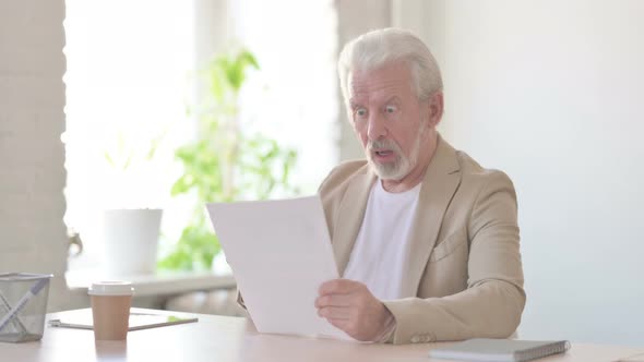 Upset Old Man Feeling Upset While Reading Documents