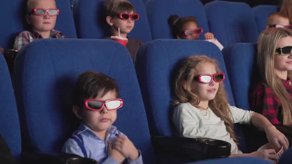 Happy Kids Watching Funny 3d Cartoon at Modern Cinema