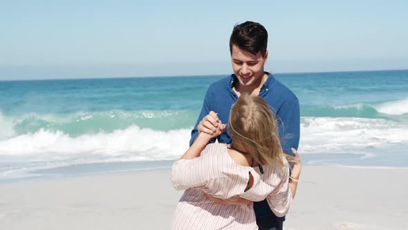 Couple in love enjoying free time on the beach together