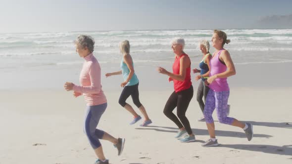Senior women running on the beach