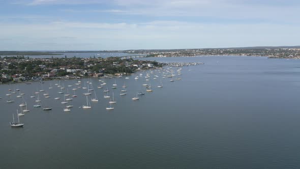 Beautiful slow aerial fly over the marina toward the famous Captain Cook Bridge at Sydney coast, Kog