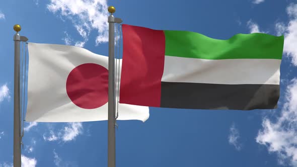 Japan Flag Vs United Arab Emirates / UAE Flag On Flagpole