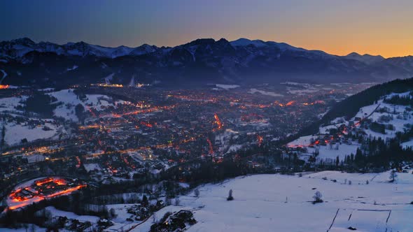 Dusk over zakopane city in winter, aerial view