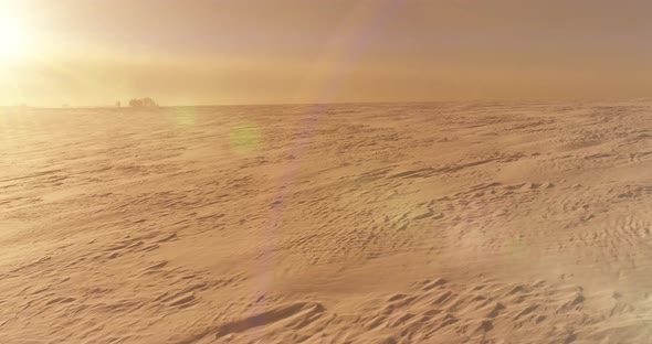 Aerial View of Cold Winter Landscape Arctic Field Trees Covered with Frost Snow Ice River and Sun