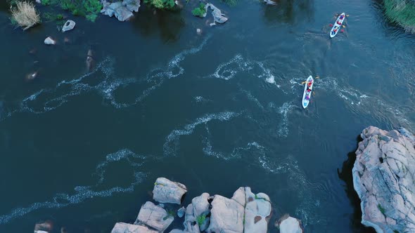 Aerial View of Rowers on Kayaks Docking to the Shore