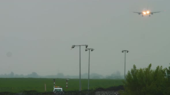 Jet Airplane Landing at Rainy Weather