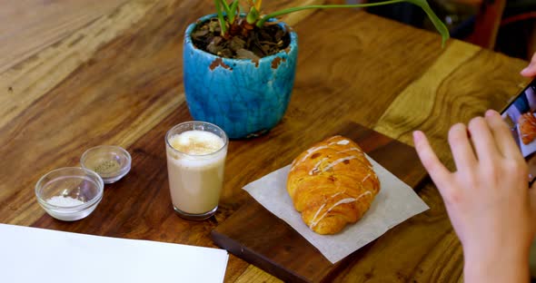 Woman Photographing Coffee and Snacks in Cafe 4k