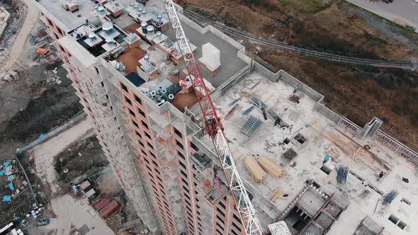 Crane Jib Near New Apartment Building at Construction Site