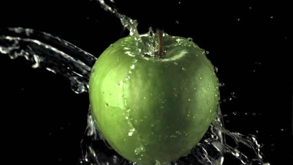 Super Slow Motion Green Apple with Splashes of Water