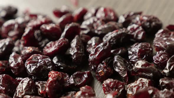 Slow pan on dehydrated red cranberries pile 4K 2160p 30fps UltraHD  footage - Shallow DOF Vaccinium 