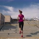 Woman is Running Over Stair on City Street During Morning Training Rear View Slow Motion - VideoHive Item for Sale