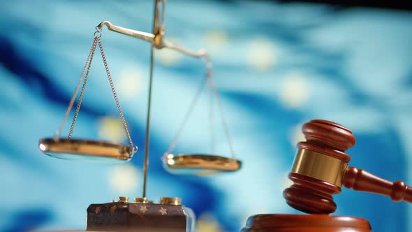 A Judge Gavel with a Flag of European Union on Background