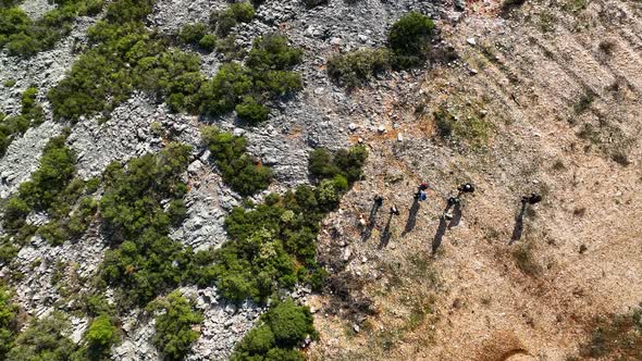 Travelers go on a hike aerial view 4 K