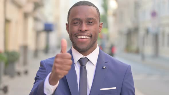 Outdoor African Businessman Showing Thumbs Up Sign