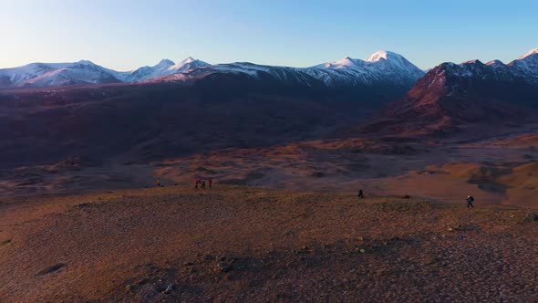 Photographers and Beltirdu Mountain Ridge. Aerial View. The Altai Mountains