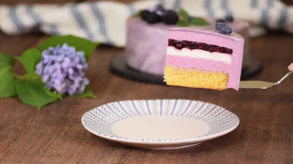 Piece of Layered Berry Mousse Cake With Mirror Glaze.