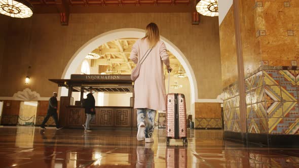 Traveler Woman in Casual Clothes Walking in Railroad Station or Bus Terminal 6K