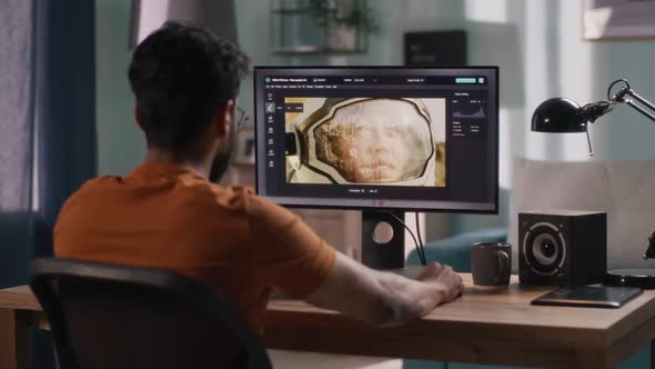 Anonymous Man Editing Cosmonaut Picture