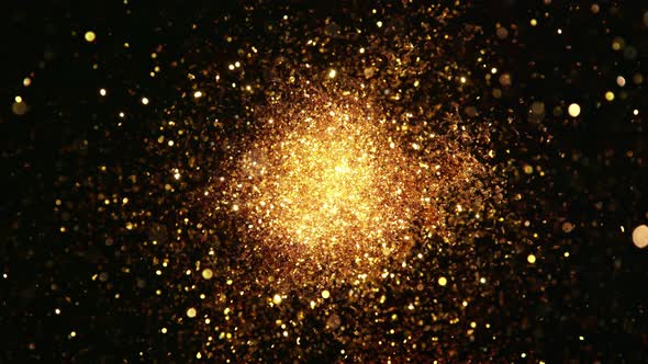 Super Slow Motion Shot of Round Golden Glittering Explosion Isolated on Black at 1000Fps