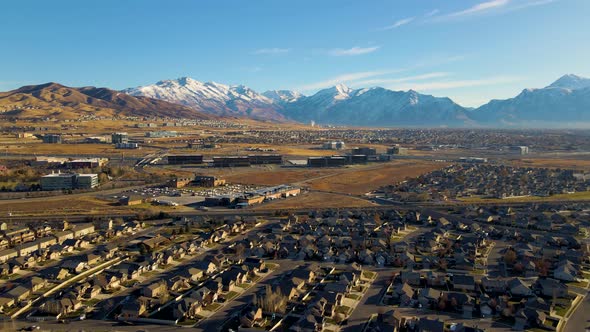 Silicon Slopes in Lehi and Highland Utah - aerial push in view of a picturesque community below the