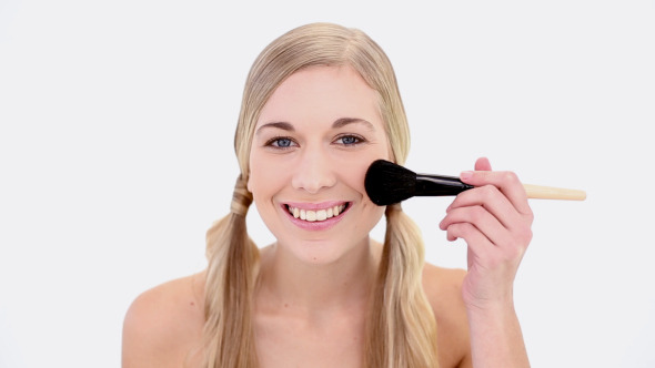 Happy Nude Blonde Using Powder Brush