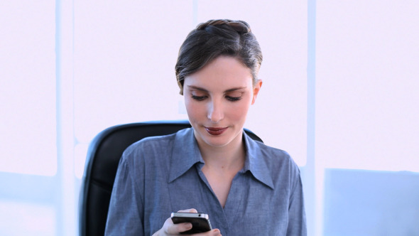 Happy Businesswoman Answering Smartphone