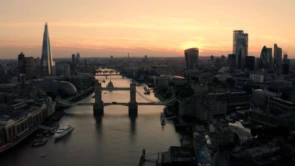 Aerial view of London, River Thames and Tower Bridge just after the sun has set and the sky is lit.
