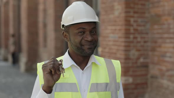 Portrait of Engineer Holding Keys From New Home