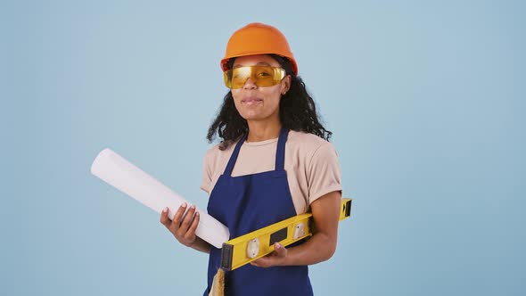 Afroamerican Woman Worker in Hard Hat Protective Goggles