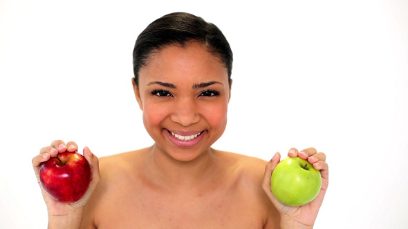 Beautiful Young Woman Holding Two Apples