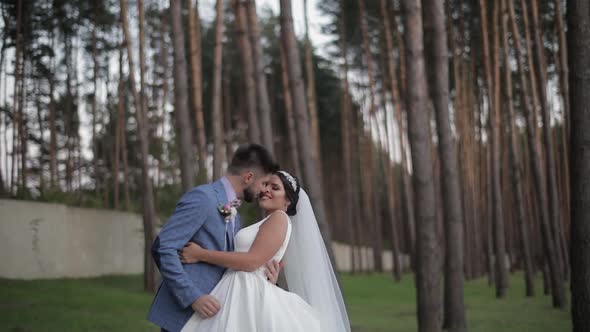 Wedding Couple Making a Kiss. Lovely Groom and Bride. Happy Family