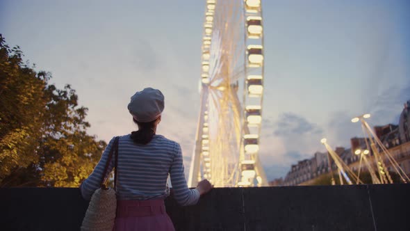 Young girl at the Ferris Wheel in France