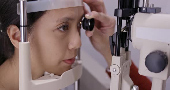 Woman undergo eye test in clinic