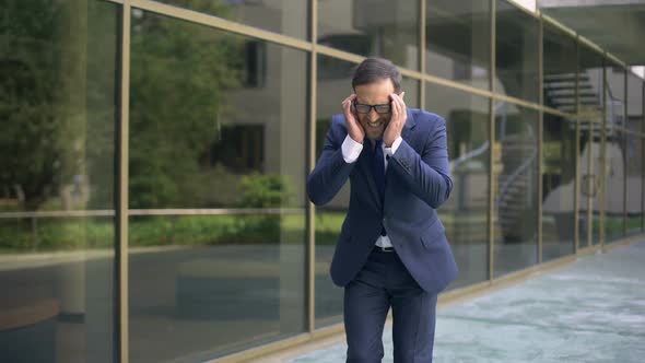 Middle-Aged Office Worker Suffering From Strong Migraine, Headache Disorder