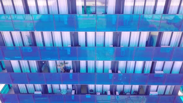 facade of a modern mirrored office building was removed from a drone. close-up