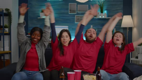 Group of Multiracial Friends Enjoying Watching Sport on Television