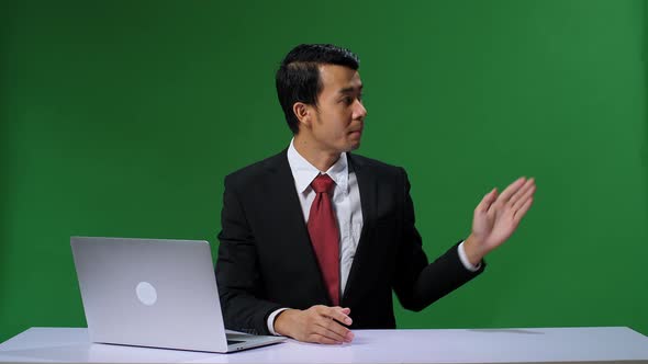 Live News Studio With Professional Asian Male Anchor Reporting On The Events. Chroma Key Template