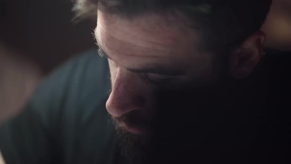 Bearded Man Busy On Studying For Exam. - reveal shot