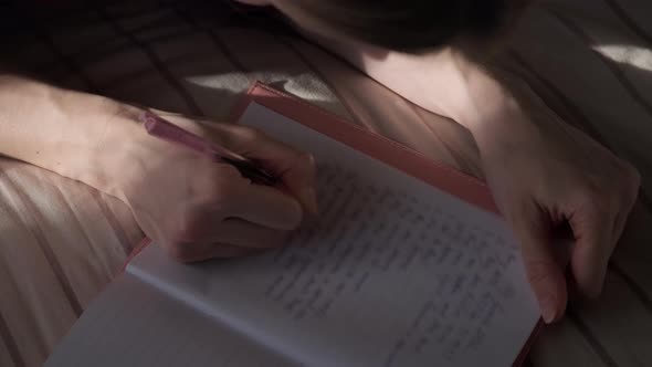 Woman Writing in Diary