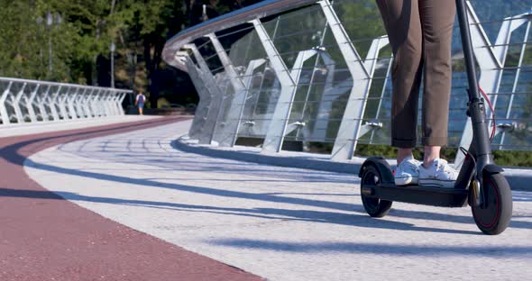 Modern Woman On Electric Scooter