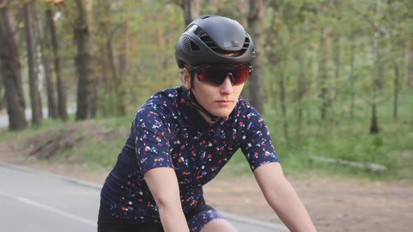 Girl is riding bike in the park. Cycling concept