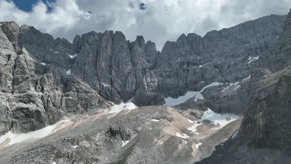 Hikers and travelers enjoy the beautiful mountain views as they have a walk in the Dolomites