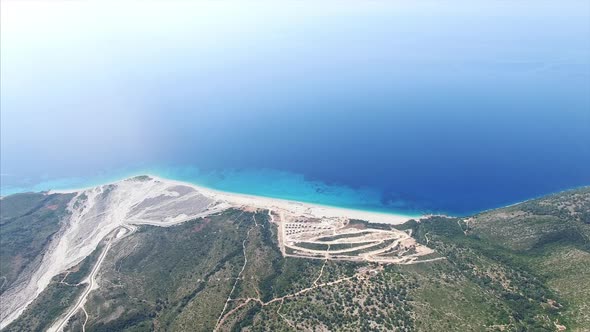 Overhead shot of beach next to mountains