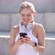 Cheerful Sportswoman Using Smartphone on Street - VideoHive Item for Sale