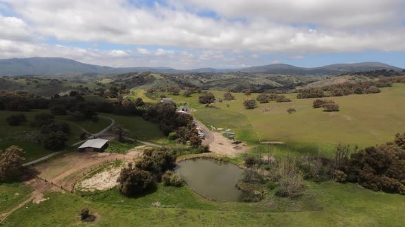 Aerial view chasing a black helicopter over the hills near Santa Ysabel, California.