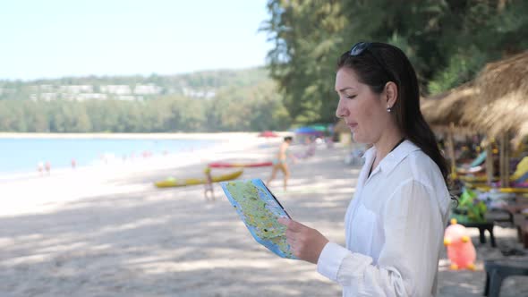 Lady Comes To Ocean Beach Holding Map and Follows Pointers