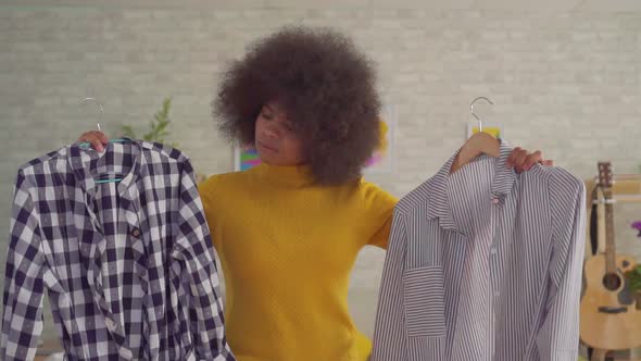 African Woman with an Afro Hairstyle Desperate Does Not Know What To Wear on a Date Slow Mo