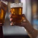 Hands of a couple cheers with beer at a bar in Patagonia Argentina - VideoHive Item for Sale