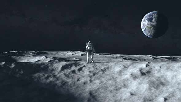 An Astronaut Stands on the Surface of the Moon Among Craters Against the Backdrop of the Planet